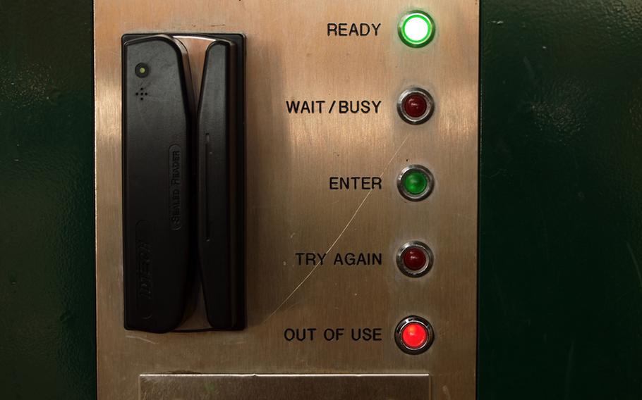 At Kleber Kaserne in Kaiserslautern, a panel of lights on an automated pedestrian gate tells would-be users that it is both "ready" and "out of use." The gate froze up after denying entry to a pedestrian and had to be reset.