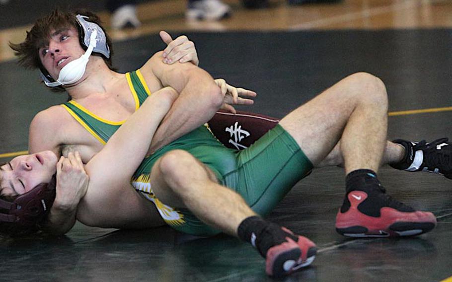 Robert D. Edgren's Hunter Mathews gains the advantage on Hinun Crespin of Matthew C. Perry during a 129-pound bout in Saturday's Robert D. Edgren Invitational Wrestling Tournament at Misawa Air Base, Japan. Mathews took the weight-class bronze medal.