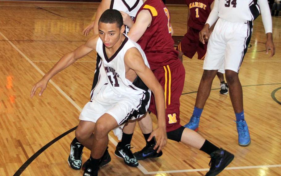Matthew C. Perry's Keese Adams attempts to recover the ball as teammates Garrett Macias and David Eason have their path to the ball blocked by Carl Sunwall of Marist Brothers International School during Saturday's high school boys basketball game at Marine Corps Air Station Iwakuni, Japan. The Samurai won 53-21.
