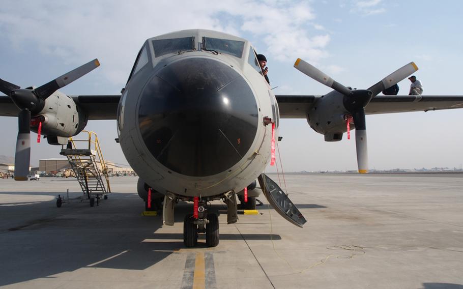 Maintenance workers inspect an Afghan Air Force C-27A Monday at Kabul International Airport. The entire fleet was grounded in December 2011 due to maintenance issues that still haven't been resolved.