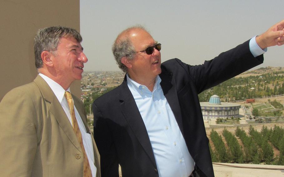 Special Inspector General for Afghan Reconstruction John F. Sopko, right, and Consul Brad Hanson survey area around U.S. Consulate in Herat in August 2012.