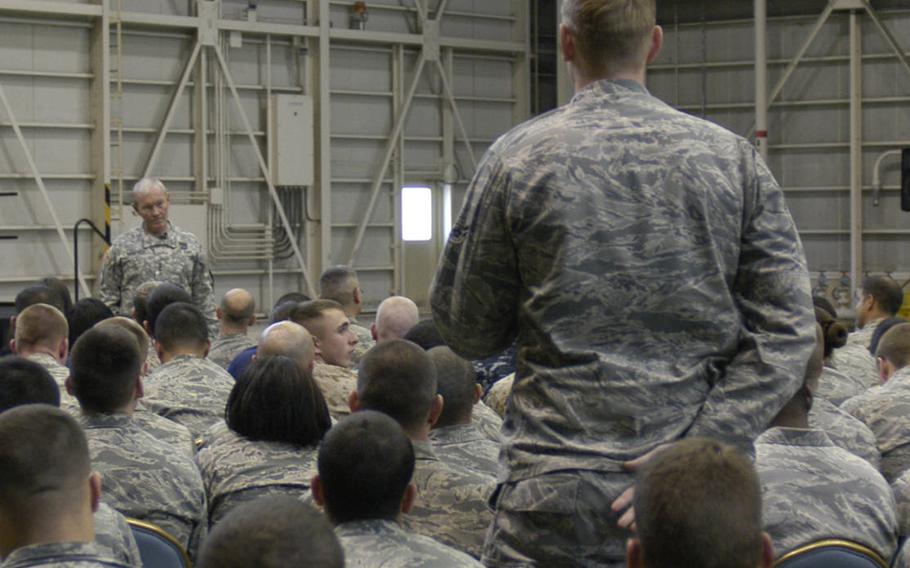 Gen. Martin E. Dempsey, chairman of the Joint Chiefs of Staff, listens to a servicemember's question during a visit Thursday to Yokota Air Base, Japan. Dempsey told servicemembers that there shouldn?t be additional large-scale reductions in the numbers of forces stationed overseas.
Eric Guzman/Stars and Stripes