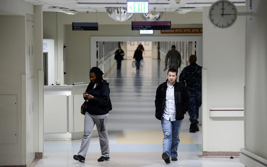 People walk through Landstuhl Regional Medical Center's "four corners," which much of the staff uses as a reference point when giving directions to patients and visitors lost in the hospital's three miles of hallways. Landstuhl, which admitted hundreds of wounded troops a month at the height of the wars in Iraq and Afghanistan, hasn't been treating enough trauma patients over the last two years to maintain its Level I trauma center status.