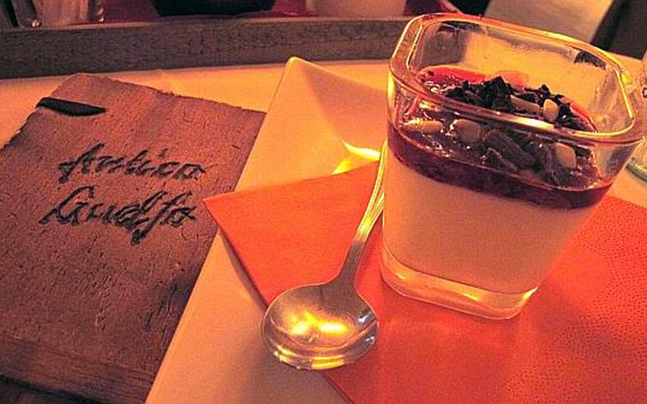 A "Coppa dei Tre Peccati," or Cup of Three Sins, is a popular option following dinner at Antico Guelfo, a restaurant in Vicenza, Italy. It's made of white chocolate mousse and yogurt covered in strawberry sauce and topped with sliced almonds and chocolate shavings.