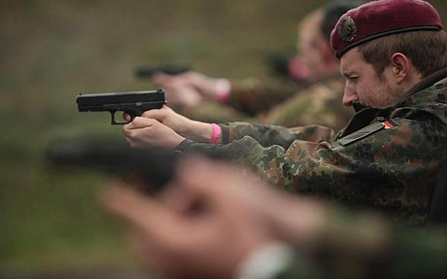 Competitors take aim with Glock pistols at the Monte Kali shooting competition Friday in Wackernheim, Germany. About 280 four-man teams from around Europe were taking part in the event, which the U.S. Army has hosted for the last 30 years.