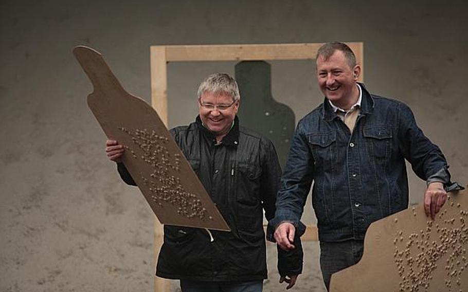 Two competitors in the Monte Kali shooting competition Friday in Wackernheim, Germany, were pleased with their marks with the American M-249 squad automatic weapon.