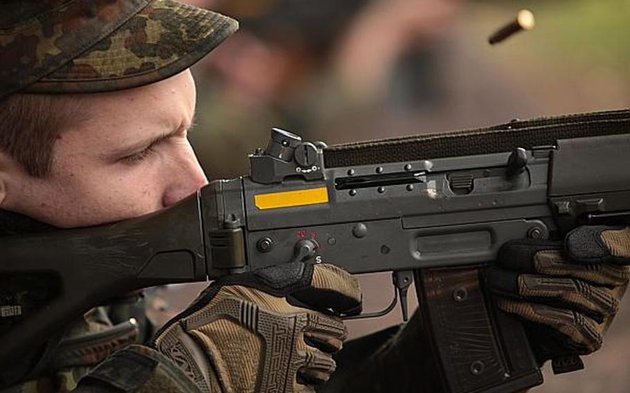 A German soldier pops off a round with a Swiss Army Sturmgewehr 90 assault rifle at the Monte Kali shooting competition Friday in Wackernheim, Germany. Matt Millham/Stars and Stripes