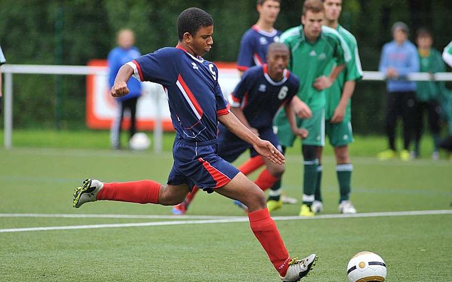 Aviano's Lorenzo King scores his team's 1-0 on a penalty against SHAPE on opening day Division II action at the DODDS-Europe soccer championships Monday. King added another goal for a 2-0 lead, but the Saints fell to the Spartans 3-2.