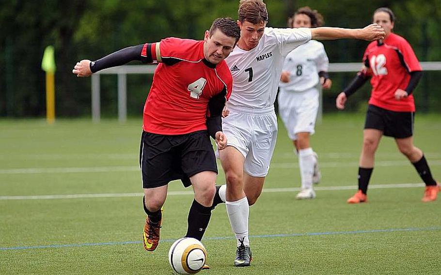 Schweinfurt's Logan Mansfield, left, and Frank Spatt of Naples fight for a ball in the teams' 1-1 tie on opening day of the DODDS-Europe soccer championships.