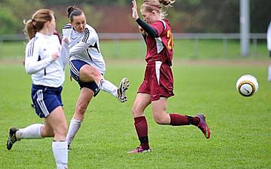 Menwith Hill's Kaia Pierce gets a shot off past Baumholder's Aubree Harvison in Menwith Hill's 3-2 win over the Buccaneers.