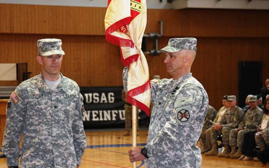 Col. Michael Runey, left, turns over command of the U.S. Army garrison in Schweinfurt, Germany, to Col. Kelly Lawler at a ceremony May 22, 2013. The garrison is slated to close this fall.
U.S. Army photo