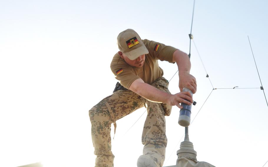 German soldier prepares a German Dingo truck for a force protection mission outside the gates of FOB Marmal in Mazar-e-Sharif, Afghanistan.
