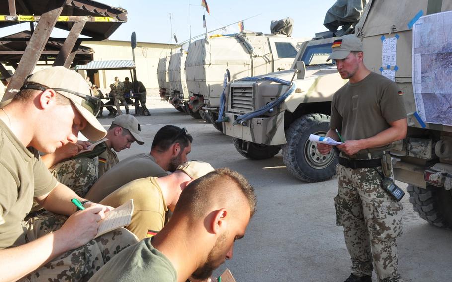 Master Sgt. Steffen A. briefs his soldiers for their force protection mission outside the gates of FOB Marmal in Mazar-e-Sharif, Afghanistan.