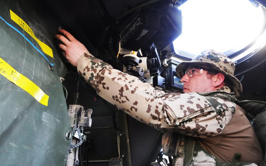 Staff Sgt. Daniel W. prepares his vehicle for a force protection mission outside the gates of FOB Marmal in Mazar-e-Sharif, Afghanistan.
