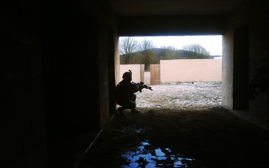 A soldier with 2nd Platoon, Troop L, surveys his surroundings during the 2nd Cavalry Regiment's pre-deployment exercise in March in Hohenfels, Germany. 