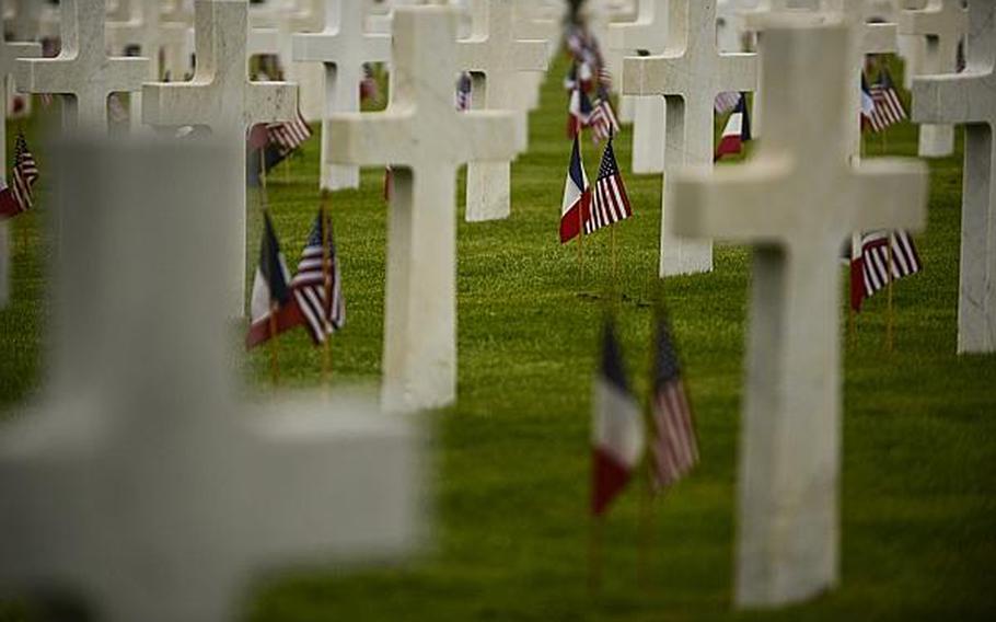 U.S. and French flags are planted next to headstones of the more than 14,000 American servicemembers who lost their lives in the Meuse-Argonne Offensive of World War I. An American Memorial Day ceremony was held Sunday at the Meuse-Argonne American Cemetery and Memorial in France. Joshua L. DeMotts/Stars and Stripes