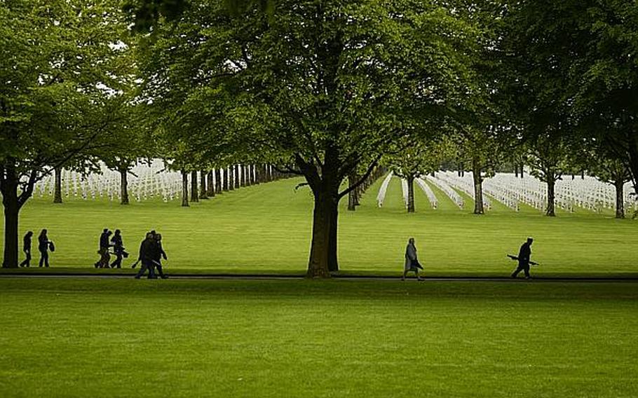 Guests and visitors at the American Memorial Day ceremony Sunday at the Meuse-Argonne American Cemetery and Memorial in France walk toward the main entrance of the cemetery after the ceremony. Joshua L. DeMotts/Stars and Stripes