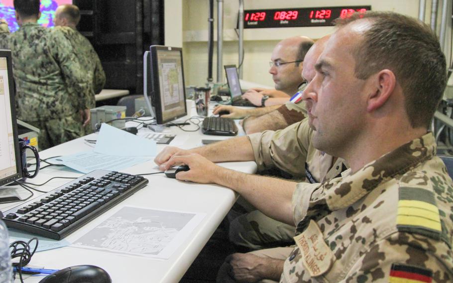 Cmdr. J.G. Thorsten Klinger of the German navy works in the joint operation center of the international mine countermeasures exercise aboard the USS Ponce May 16th. The U.S. was among 41 nations participating in the exercise in the Persian Gulf.