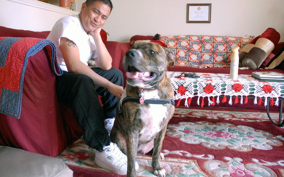 Capt. Anthony Martinez at his home in Killeen, Texas, with his service dog, Reese, in 2012.