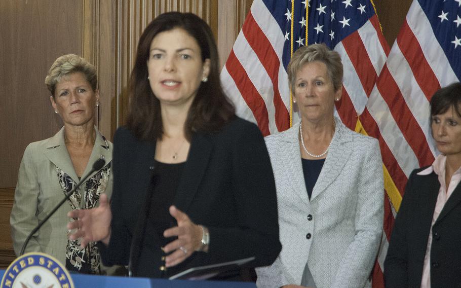 Sen. Kelly Ayotte, R-N.H., (center) and Sen. Claire McCaskill, D-Mo., spoke to reporters Thursday about proposed legislation to address sexual assault prosecutions in the military.