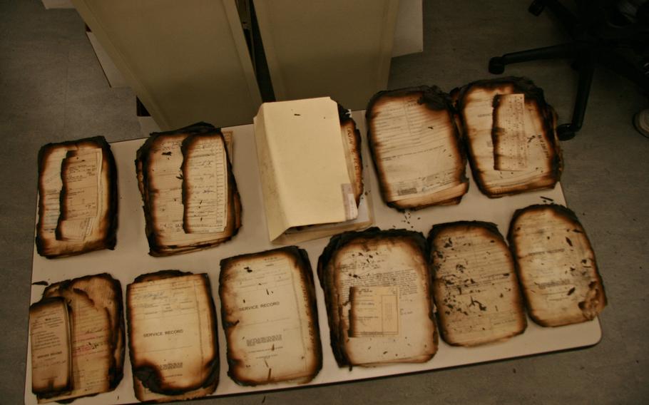 These documents are among the millions that were burned during the 1973 disaster. Technicians painstakingly separate, photocopy and preserve them.