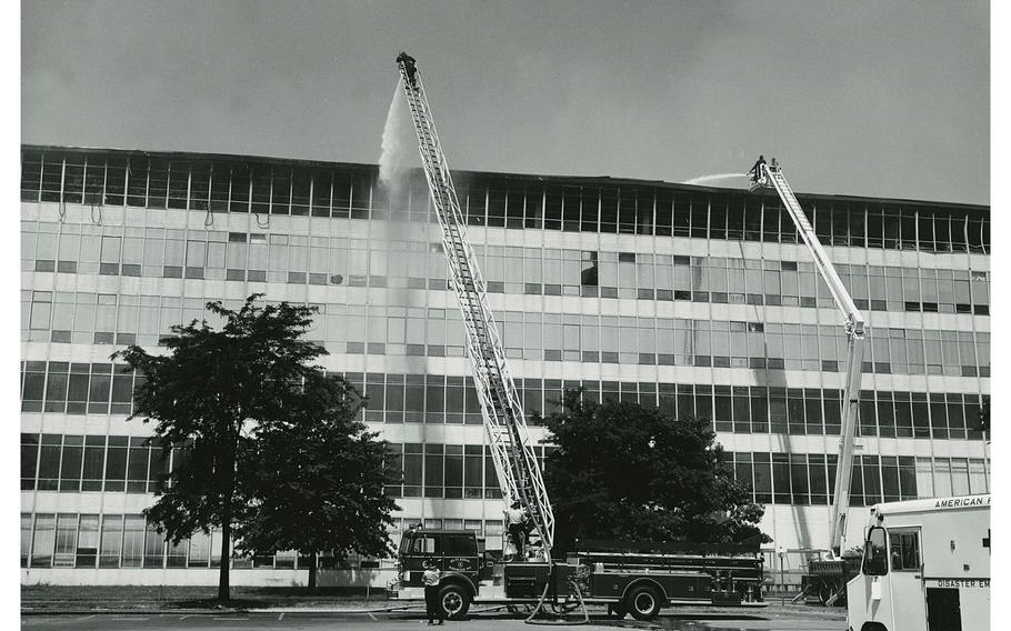 Firefighters work to extinguish the massive fire on the sixth floor of the National Personnel Records Cemnter in St. Louis in July 1973. The fire burned for almost five days. 