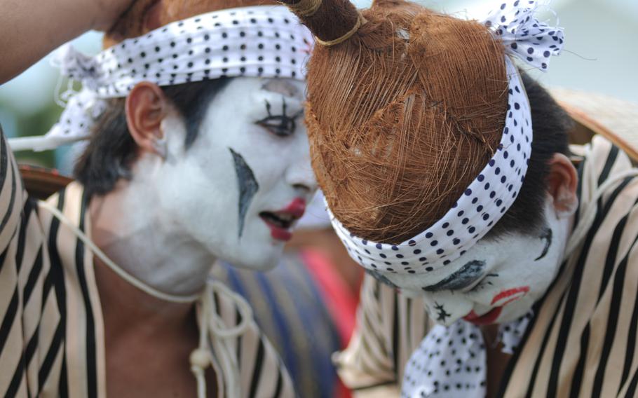 Eisa performers wear elaborate traditional costumes at the 58th Okinawa Zento Eisa Matsuri contest in Okinawa City, Okinawa, Sept. 1, 2013.