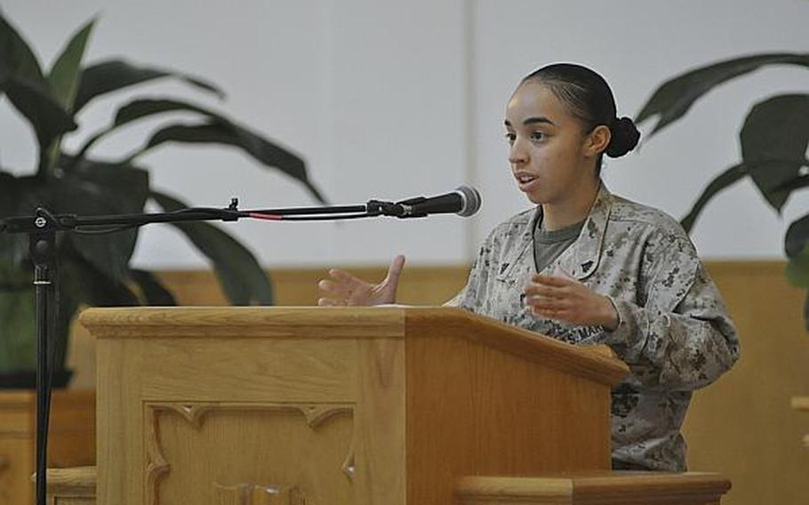 Marine Cpl. Andrea Arenas Vazquez speaks during a memorial service for her cousin, Petty Officer 2nd Class Naem Igrayeb, in Naples, Italy, on Friday, Sept. 6, 2013. Igrayeb, 25, an information systems technician from Brooklyn, N.Y., died in a motorcycle accident last week in a Naples suburb.