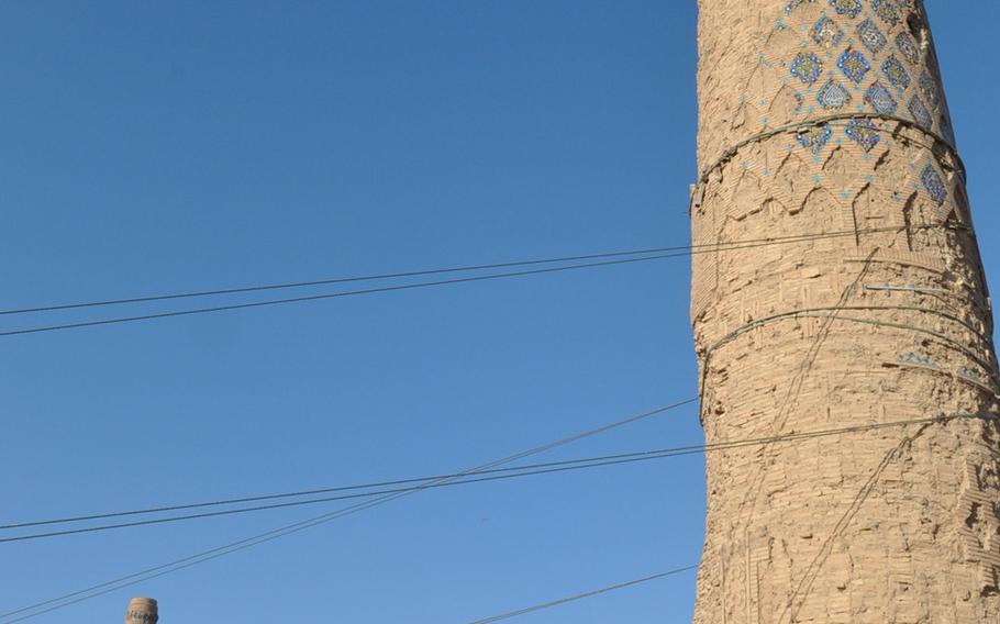 The minarets of the Musalla complex in Herat, Afghanistan. Steel cables have been installed to stabilize the minaret in the foreground, which is in danger of collapse.