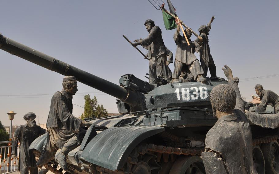 A Soviet tank adorns a busy traffic circle in Herat, Afghanistan, as a tribute to the Mujehideen, the guerrilla fighters who pushed the Soviet Red Army out of Afghanistan after a bloody 10-year war.