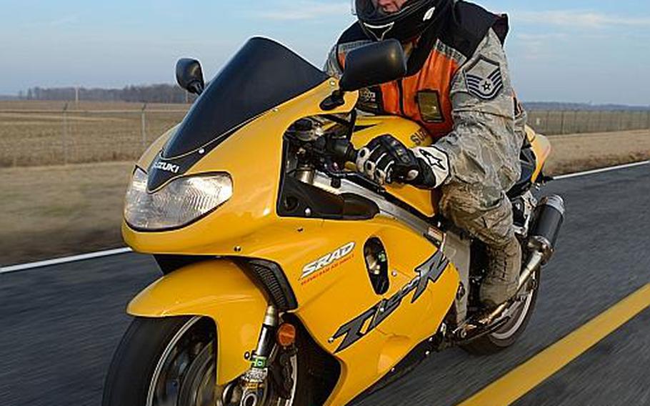 As of September, the Air Force no longer requires that airmen wear a high visibility clothing, such as the orange vest worn by Master Sgt. John Willard Jr. while riding at Dover Air Force Base, Del., Tuesday, Jan. 29, 2013. Individual commands, however, still have the power to require airmen to wear reflective clothing.
Greg L. Davis/U.S. Air Force