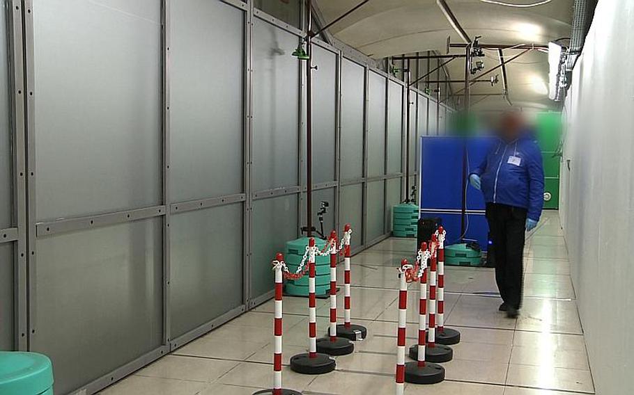 Working in real time, the video surveillance system from NATO's Stand-off Detection of Explosives program picks out a suspicious individual among the passengers in the corridors of a public transport building. An image of the person appears on the operator's screen.