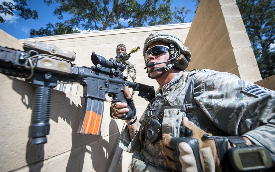 Staff Sgt. Pablo Cancel keeps a lookout at the military operations in urban terrain, or MOUT, village during Exercise Global Eagle on Oct. 17, 2013, at Moody Air Force Base, Ga.