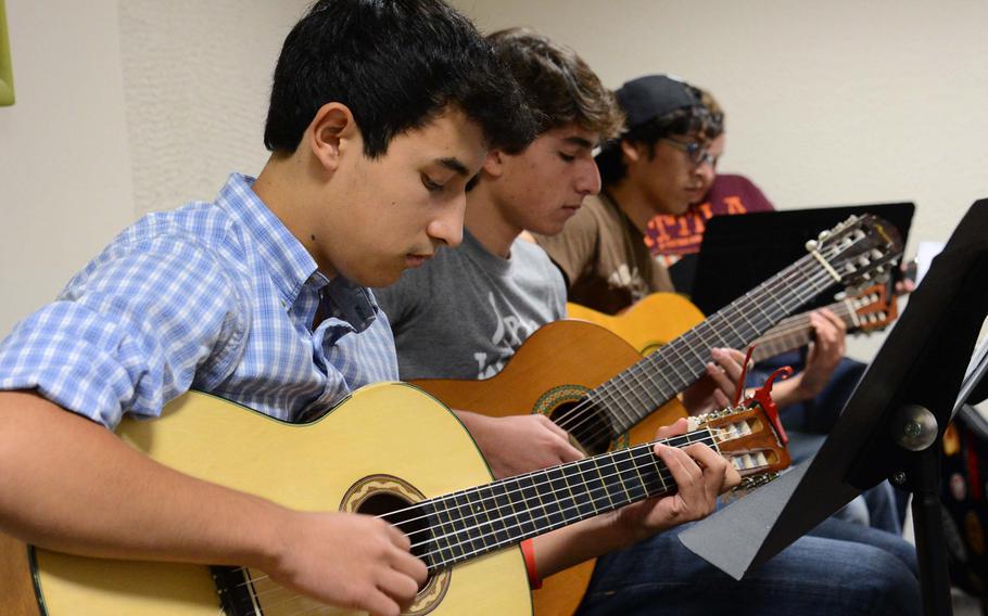 Participants in the guitar workshop practice a song during a session at this year's Creative Connections. More than 160 students from DODDS-Europe high schools participated in this year's event that features 11 workshops in the visual and performing arts.