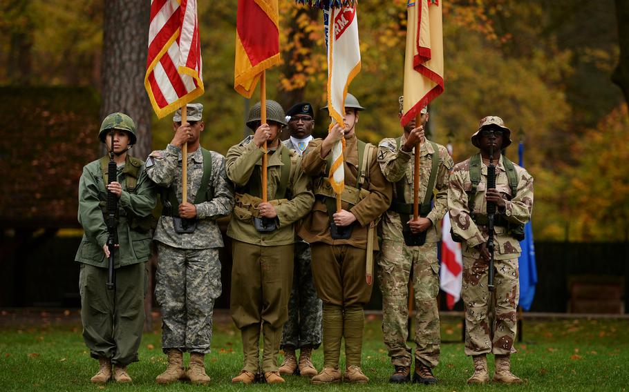 The 21st Theater Sustainment Command color guard wears period uniforms as they perform for a Veterans Day Observance at Panzer Kaserne, Germany, Thursday, Nov. 7, 2013.