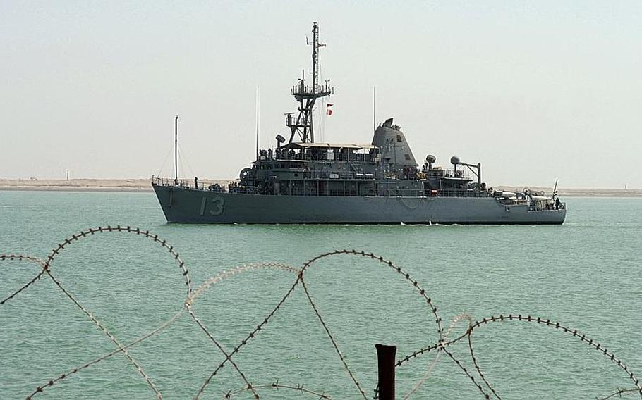 The mine countermeasures ship USS Dextrous approaches the Iraqi navy pier in Umm Qasr, Iraq. The commander of the Bahrain-based vessel was relieved of his duties Wednesday ?due to loss of confidence in ability command."