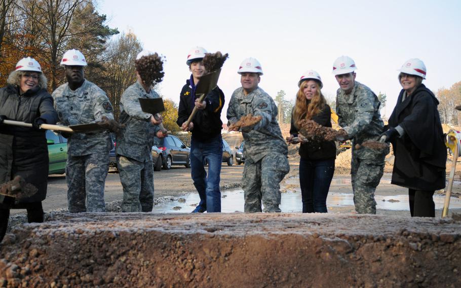 Army officials from Stuttgart, the Army Corps of Engineers and students from Patch High School take part in the groundbreaking ceremony Tuesday at the site of the future Stuttgart High School and Stuttgart Elementary School.
