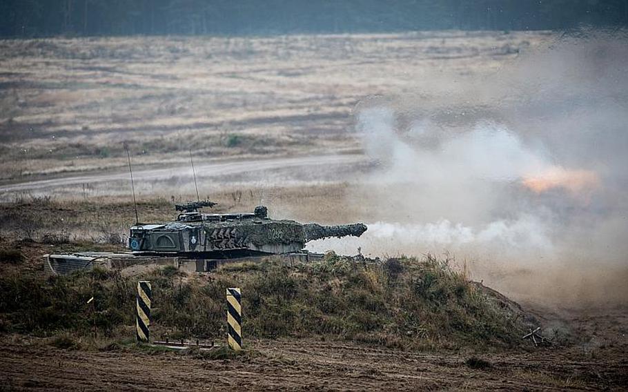 A Polish Leopard II tank fires at the Drawsko Pomorskie Training Area, Poland, on Nov. 7, 2013, during NATO's Steadfast Jazz exercise. Ian Houlding/NATO
