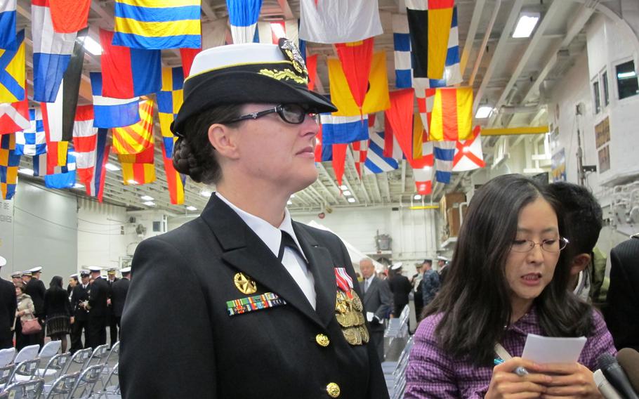Navy Capt. Heidi Agle addressed the media shortly after taking command of Amphibious Squadron 11 Thursday morning aboard the USS Bonhomme Richard at Sasebo Naval Base. Agle wasn't able to celebrate long as she was forced to rush from the ceremony to the USS Germantown and her ride to the Philippines to assist in relief efforts there. Three of the squadron's four ships are foregoing scheduled maintenance to aid efforts in the Philippines. The USS Germantown and USS Ashland departed Sasebo on Nov. 24, 2013. The USS Denver will depart sometime next week. The Bonhomme Richard is too far into routine maintenance to head out to sea, Agle said.