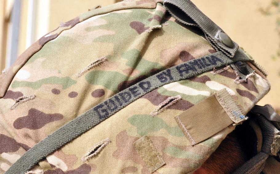 The helmet of public affairs officer Sgt. Edward Siguenza, a California Army National Guardsman attached to Task Force Guam at Camp Phoenix in Kabul. Siguenza was born and raised in Guam before moving with his family to California in 2004. His helmet reads, "Guided by familia."