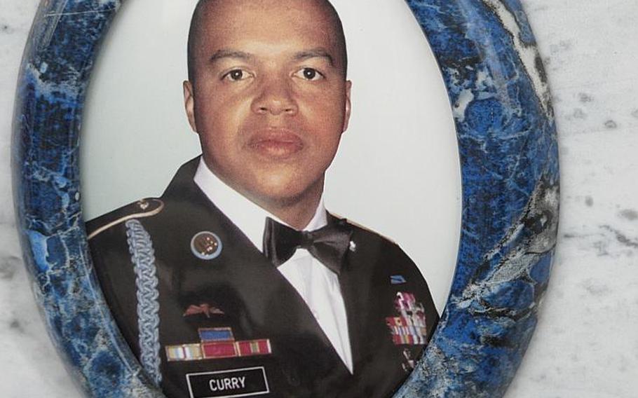 1st Sgt. Michael Curry was born in the U.S., died in Afghanistan and was buried in Italy where he'd made his home and life. His photograph appears on his cemetery site in Grantorto, Italy.