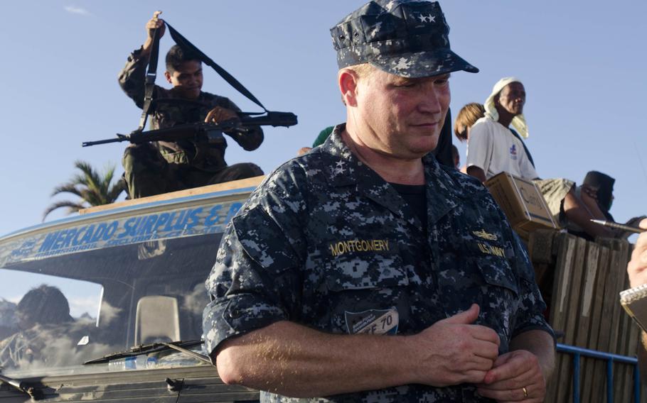 Rear Adm. Mark C. Montgomery, commander of the USS George Washington Carrier Strike Group, visited Tacloban Airport, Tacloban, Philippines on Nov. 16, 2013. Eric Guzman/Stars and Stripes