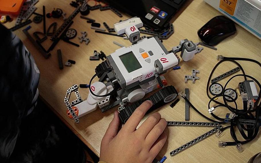 A student builds and programs a robot Tuesday, Nov. 19, at the DODDS-Europe STEMposium in Oberwesel, Germany. The event included 108 students from DODDS high schools across Europe, and steeped them for a week in various aspects of science, technology, engineering and math.