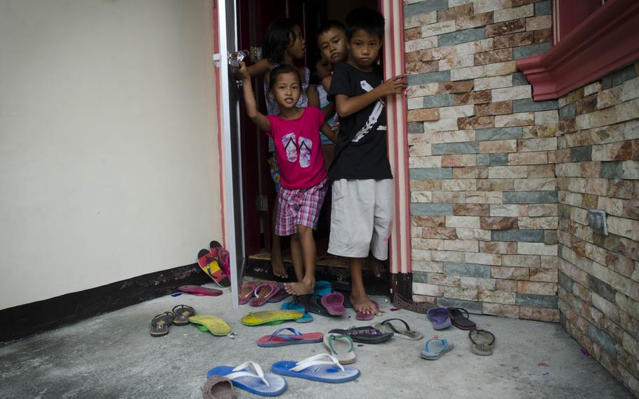 Mike and Regina Sculley are providing food and shelter for nearly 30 victims of Super Typhoon Hiyan.