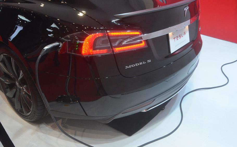 66p na Tesla's Model S allows drivers to charge their cars overnight, but like they would their cell phones.