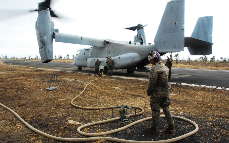 Marines load jet fuel from a forward refueling point at Guiuan into a V-22 Osprey on Friday. After more than week on the ground helping Typhoon Haiyan victims, the Marines are packing up and heading back to Okinawa.