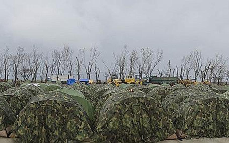 Shelters were donated to the Philippines to help house refugees and non-government organization volunteers. The shelters were stood up near Tacloban Airport, Tacloban, Philippines on November 21, 2013.