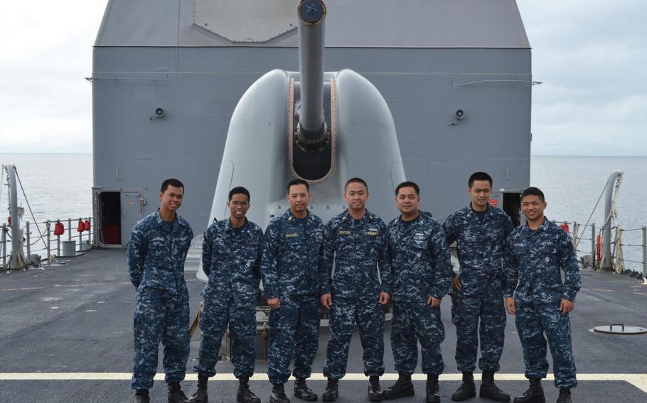 These seven Philippine-born sailors serving aboard the Yokosuka, Japan-based guided missile cruiser USS Cowpens are currently assisting in Typoon Haiyan relief efforts. They are, from left: Seaman Broderick Marteja, Petty Officer 3rd Class Jireh Pait, Senior Chief Petty Officer Jeruel Simsuango, Chief Petty Officer Conrad Ventura, Petty Officer 1st Class Roel Villasin, Petty Officer 3rd Class Neil Solis. Petty Officer 3rd Class Rainier Samalea.