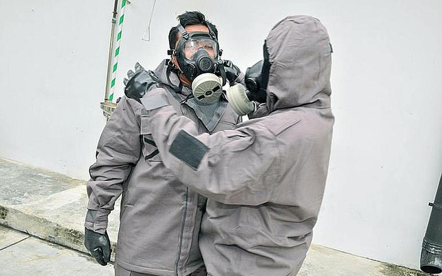 Inspectors from the Organization for the Prohibition of Chemical Weapons are in Hohenfels, Germany, for three days of hostile environment training in preparation for deployments to Syria and other potential hotspots. The Joint Multinational Readiness Center is providing training to about 25 members of the OPCW. In this photo, protective gear is demonstrated during a regional training course on emergency response to chemical incidents held in Singapore in 2011.