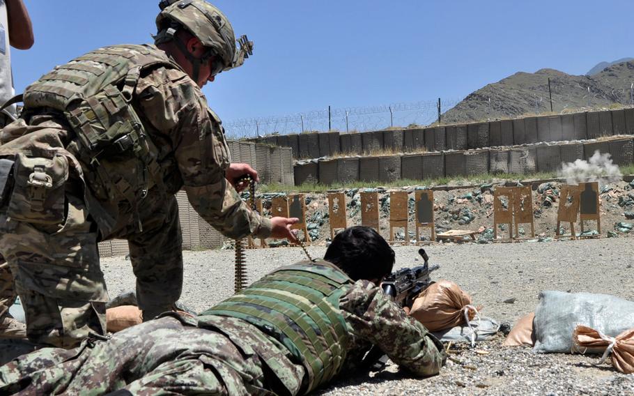 The decision by Afghanistan???s Loya Jirga council to allow foreign advisers to remain in the country after 2014 means that several thousand U.S. and NATO instructors will likely continue to train Afghan forces. In this photo, an adviser, Sgt. Josh Baue, works with Afghan troops during training at Forward Operating Base Joyce, in eastern Afghanistan.